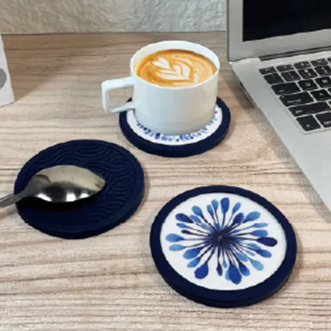 ceramic and silicone cup coasters used for coffee on office desk