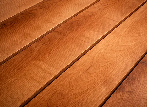 [REPLACE] Cherry wood coaster with reddish-brown hue